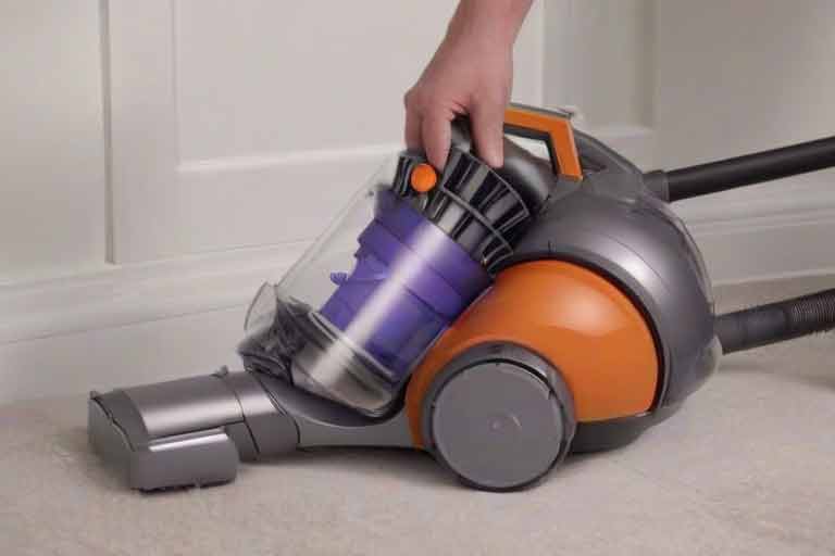 ¿Cómo vaciar el depósito de mi aspiradora Dyson?